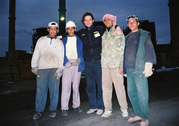 Shield Rodirigo from Argentina with workers at the Daurah power plant 