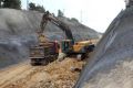 Volvo bulldozers being used to build Israel's wall in al-Walaja June, Anne Paq
