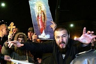 ugly guys with jesus picture outside gay club in moskow. eeeek...